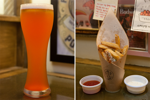 道を歩けばぶつかると言わんばかりに韓国中に旋風を巻き起こしているクリーム生ビール店。その火付け役「狎鴎亭（アックジョン）ボングビア」は、釜山（プサン）でスタート以来、今やソウルを始め全国に５００店以上の加盟店が出来ている超人気店です。気軽に立ち寄ってリーズナブルに生ビールとおつまみを楽しめるのが魅力！