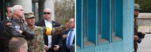 訪韓中であるマイク・ペンス米副大統領が４月１７日午前、厳しい警護を受けながら京畿道坡州市板門店を訪問し、北朝鮮側の地域を眺めている。右側はペンス副大統領一行を見守っている北朝鮮軍。（写真＝共同取材団）