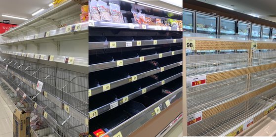 都内にあるスーパーの陳列棚から商品がなくなっている。左側からラーメン、肉、パンコーナーの様子。［読者　パク・ヘジョン］
