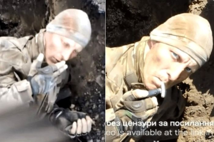   ウクライナ軍のドローンを見つめながらたばこを吸うロシア軍兵士。［写真ＳＮＳ］