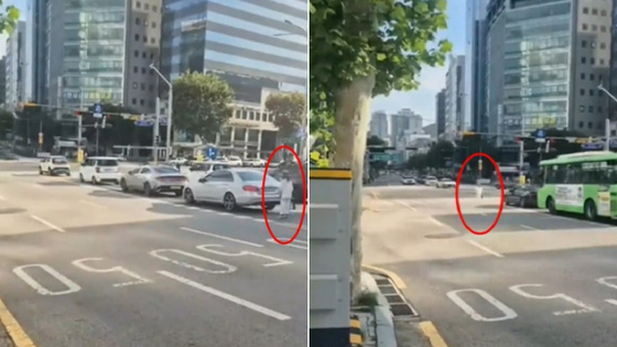 ソウルの往復4車線道路上で、車両とともに信号待ちをした後、左折して移動する女性の姿。［オンラインコミュニティ キャプチャー］