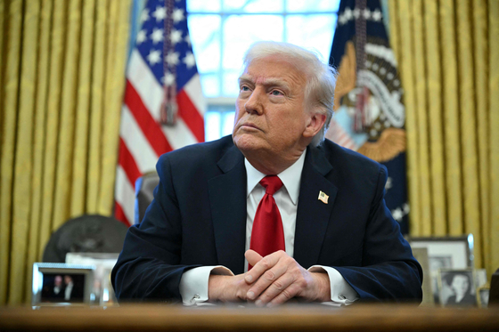 トランプ米大統領が昨年3月、米国に輸出される外国製自動車に対する品目別関税施行を発表している。［写真 AFP＝聯合ニュース］