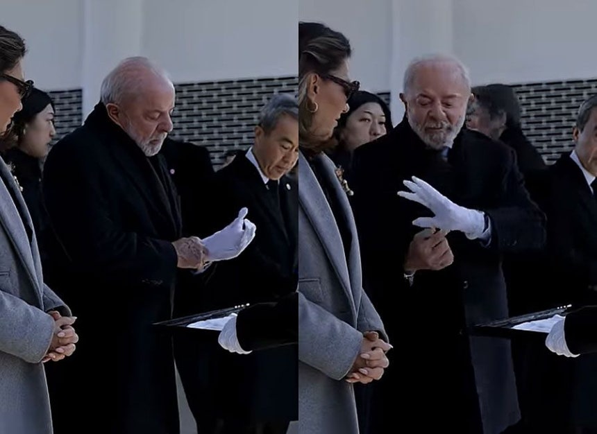 ブラジルのルラ大統領が訪韓日程中の23日、顕忠院参拝当時に手袋をはめながら左手小指の部分がないことを妻に話す姿。 ［ルラ大統領ユーチューブ キャプチャー］