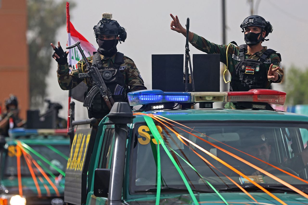   バグダッドで行われた米軍主導の連合軍撤収を知らせる軍事パレード。AFP＝聯合ニュース